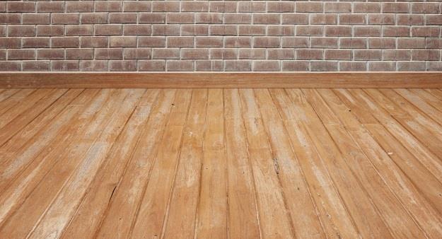 wooden-floor-with-brick-wall_1249-179